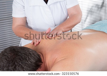 Close-up on the back of the man - massage