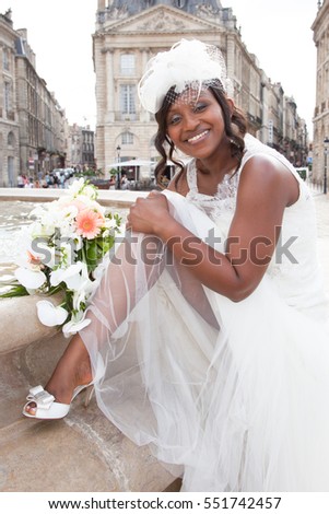 Similar – Foto Bild Braut an ihrem Hochzeitstag, die eine Blume vorschlägt