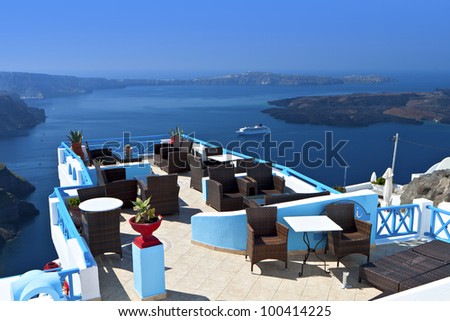 Lounge bar at Santorini island in Greece with spectacular view at the volcanic  caldera and the sea