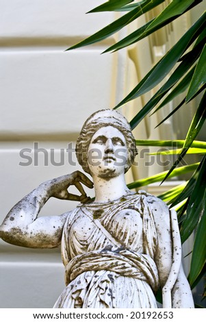Greek classic era statue in front of a building in Greece