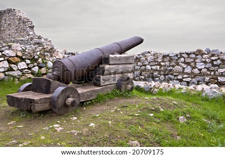 Medieval era castle in South Europe with an old gun.