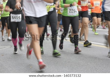 Men and women running marathon