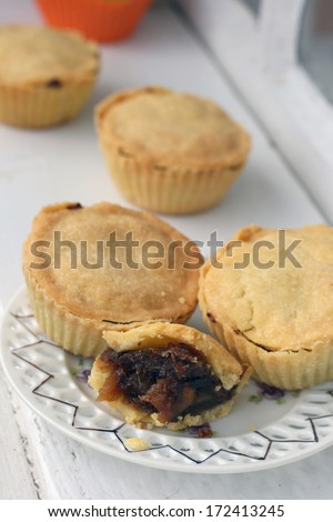 Mini pie filled with plum, apple, dried plum and apricot and candied fruit filling