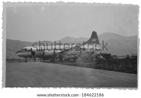DUBROVNIK, YUGOSLAVIA (CROATIA) - circa 1955: Vintage photo of an old propeller passenger plane American CV 440 of JAT Airlines getting ready for takeoff.  Picture scratches, artifacts, and fading.