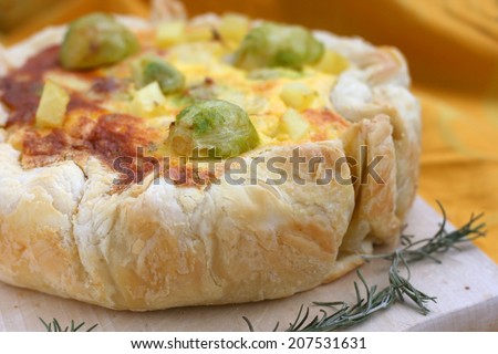 Vegetarian quiche with brussels sprout, potato, cheese, mascarpone and eggs, puff pastry