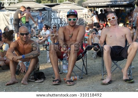 BUDAPEST, HUNGARY - AUGUST 13, 2015: Summer music festival everyday life. Visitors of Sziget music festival enjoy hot weather. Sziget is one of biggest festivals in Europe.