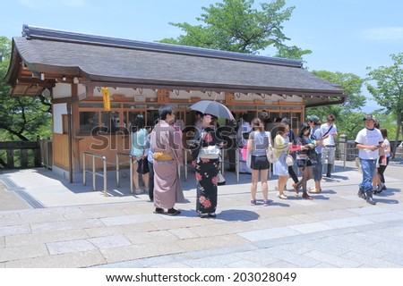 KYOTO JAPAN - 1 JUNE, 2014: Unidentified people queue at Kiyomizu Dera temple ticket office. Kiyomizu temple is an independent Buddhist temple in Kyoto and one of the most visited temple in Japan.