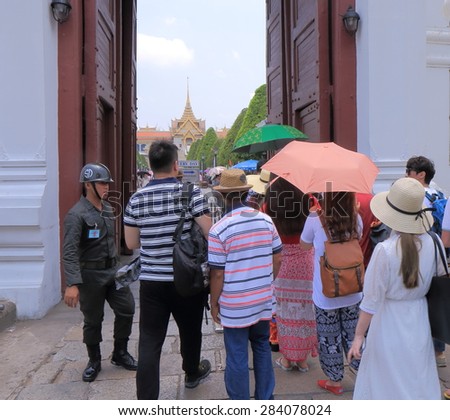 BANGKOK THAILAND - APRIL 20, 2015: Unidentified people queue at entrance of Grand Palace. Grand Palace is the most popular tourist attraction in Bangkok.
