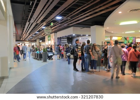 MELBOURNE AUSTRALIA - SEPTEMBER 26, 2015: Unidentified people shop at DFO outlet South Wharf. DFO, Direct Factory Outlets is the name of a no frills discount shopping centre in Australia.
