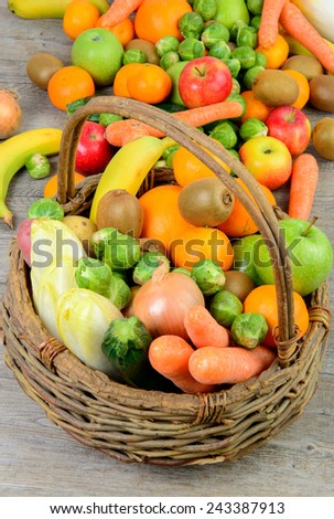 fruit and vegetable basket on the wooden table