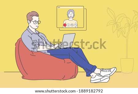 Happy young man sitting in orange beanbag chair and using laptop video conference. Work from home because infection control coronavirus. Hand drawn in thin line style, vector illustrations.