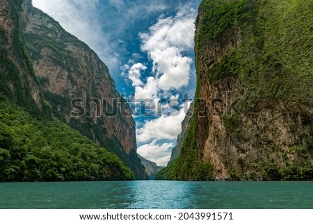 Similar – Image, Stock Photo mountain river with tall cliffs and green plants in a canyon