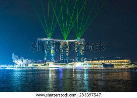 SINGAPORE - MAY 23: Marina Bay Sands hotel light show at night on May 23, 2015 in Singapore. It is the world's most expensive building with cost of US$ 4.7 billion and landmark of Singapore.