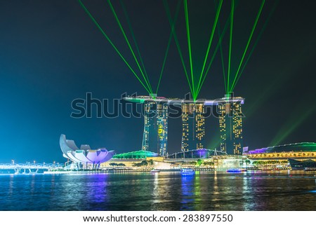 SINGAPORE - MAY 23: Marina Bay Sands hotel light show at night on May 23, 2015 in Singapore. It is the world\'s most expensive building with cost of US$ 4.7 billion and landmark of Singapore.
