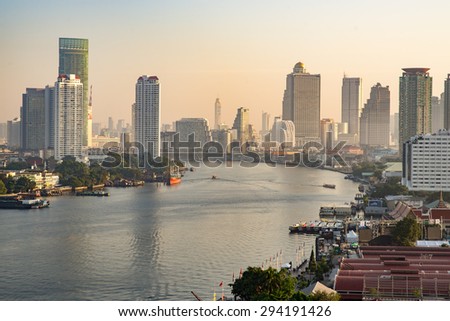 Bangkok, Thailand - December 31, 2014: Bird eye view of Bangkok city along the river during sunrise.