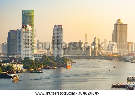 Bangkok, Thailand - December 31, 2014: Bird eye view of Bangkok city along the river during sunrise.