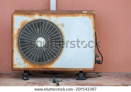 Old rusty air conditioner outdoor unit