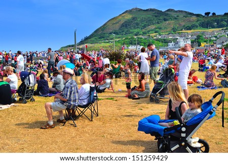 BRAY, IRELAND - JUNE 21: Unidentified people attending The Bray Air Show on July 21, 2013 in Bray, County Wicklow, Ireland. The show attracted a record-breaking crowd of 85,000.
