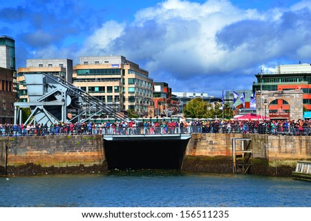 DUBLIN, IRELAND - SEPT 15: Unidentified spectators line the River Liffey at the Dublin Airfest on September 15, 2013 in Dublin, Ireland. The free air spectacular attracted 130,000 people.