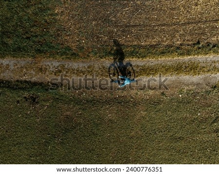 Similar – Image, Stock Photo cyclist shadows on the street in Bilbao city Spain