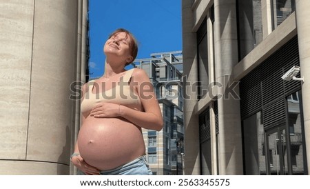 Similar – Image, Stock Photo Urban young pregnant woman