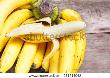 bunch of bananas on old wood, vintage style.