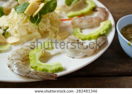 raw shrimp and spicy sauce, seafood thailand (spicy salad shrimp in fish sauce).