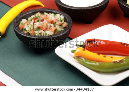 hot grilled peppers with hot pico de gallo and red peppers sauce, perfect mexican food company