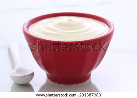 Delicious, nutritious and healthy fresh plain yogurt on vintage french cafe au lait bowl.