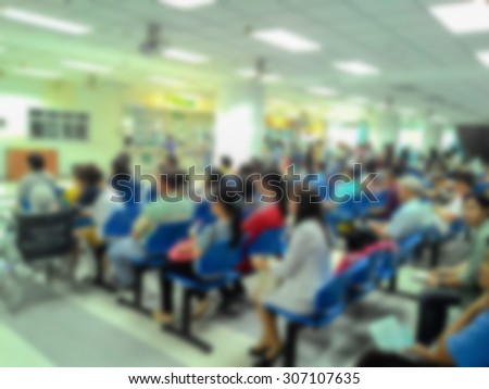 Blurred patient waiting queue for seeing a doctor, health care concept.