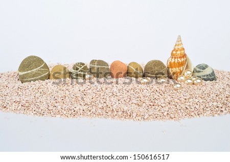Stones pearls and a shell Just a small beach scene with some space for text