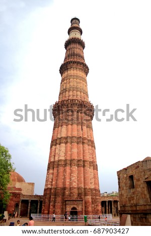 QUTUB MINAR is a 73 m high tower was built in 1193 by Qutab-ud-din Aibak after the defeat of Delhi's last Hindu kingdom. It is made of Red Sandstone. It is 15 m dia at the base and 2.5 m at the top. Photo stock © 