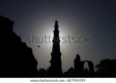 QUTUB MINAR is a 73 m high tower was built in 1193 by Qutab-ud-din Aibak after the defeat of Delhi's last Hindu kingdom. It is made of Red Sandstone. It is 15 m dia at the base and 2.5 m at the top. Photo stock © 