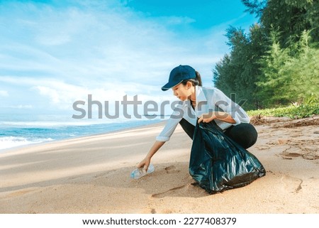 Similar – Image, Stock Photo Young woman cleaning beach area and showing plastic bottle lids in hand