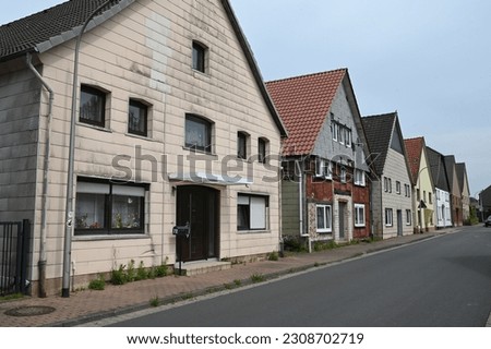 Similar – Image, Stock Photo Vacant house , lowered shutter with a sticker and the request to occupy the house.