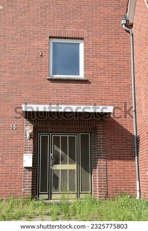 Similar – Image, Stock Photo Vacant house , lowered shutter with a sticker and the request to occupy the house.