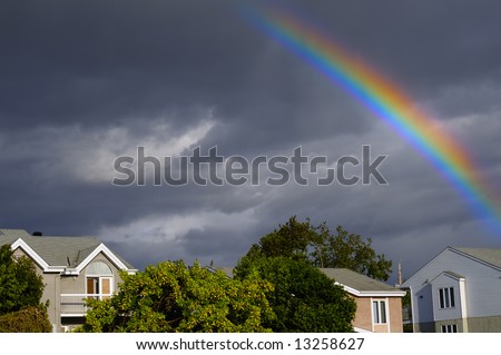 Rainbow over a typical American town after a thunderstorm