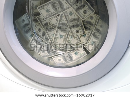 Washing machine full of 100-dollar bills money laundering concept
