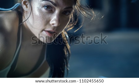 Similar – Image, Stock Photo Young woman with intense green eyes looks at camera