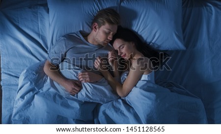 Similar – Image, Stock Photo Carefree couple resting on hill near sea