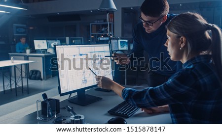 Engineer Working on Desktop Computer, Screen Showing CAD Software with Technical Blueprints, Her Male Project Manager Explains Job Specifics. Industrial Design Engineering Facility Office Stockfoto © 