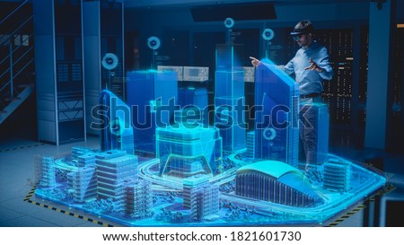 Industry 4.0: Modern Professional Architect Wearing Virtual Reality Headset Uses Gestures to Design, Manipulate Buildings for 3D City. Mixed Augmented Reality Software. VFX Graphics Effect