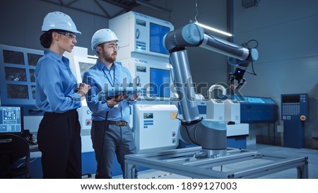 Similar – Image, Stock Photo Male technician programming machine in garage