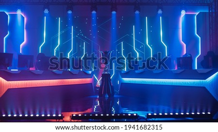 eSports Winner Trophy Standing on a Stage in the Middle of the Computer Video Games Championship Arena. Two Rows of PC for Competing Teams. Stylish Neon Lights with Cool Design. Stock foto © 