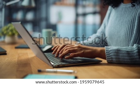 Similar – Image, Stock Photo Anonymous woman working on laptop at night