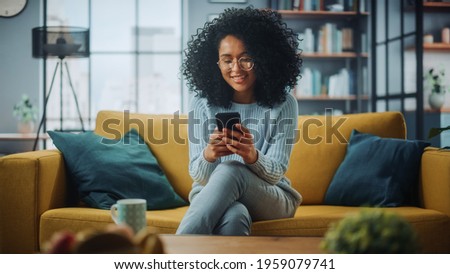 Similar – Image, Stock Photo Stylish woman browsing smartphone against sky