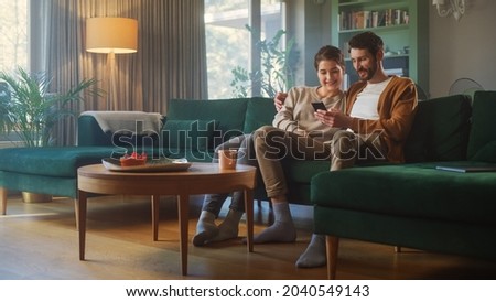 Similar – Image, Stock Photo Cheerful couple talking on video chat using laptop