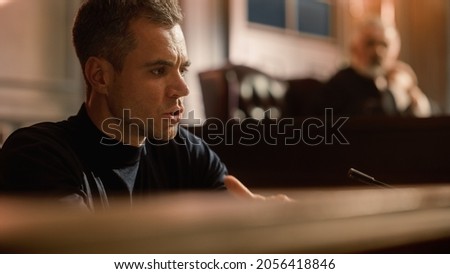 Court of Law and Justice Concept. Portrait of Handsome Male Witness Giving Testimony to Imparcial Judge, Jury. Confession of the Accused telling His Story, Repenting. Dramatic Heartfelt Moment Zdjęcia stock © 