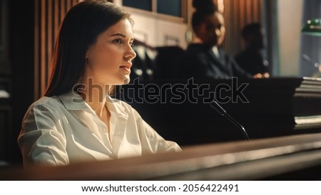 Court of Law and Justice Trial: Portrait of Beautiful Female Witness Giving Evidence to Prosecutor and Defence Counsel, Judge and Jury Listening. Dramatic Speech of Empowered Victim against Crime. Zdjęcia stock © 