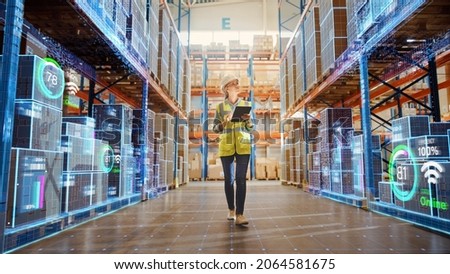 Futuristic Technology Retail Warehouse: Worker Doing Inventory Walks when Digitalization Process Analyzes Goods, Cardboard Boxes, Products with Delivery Infographics in Logistics, Distribution Center Imagine de stoc © 